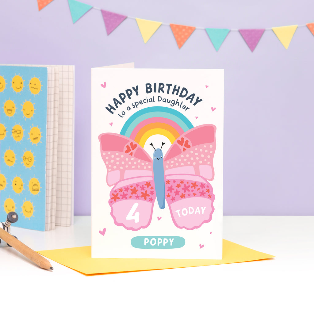 A cute and colourful card featuring an illustration of a butterfly and rainbow with the words 'happy birthday to a special daughter' with space to personalise with a name and age.