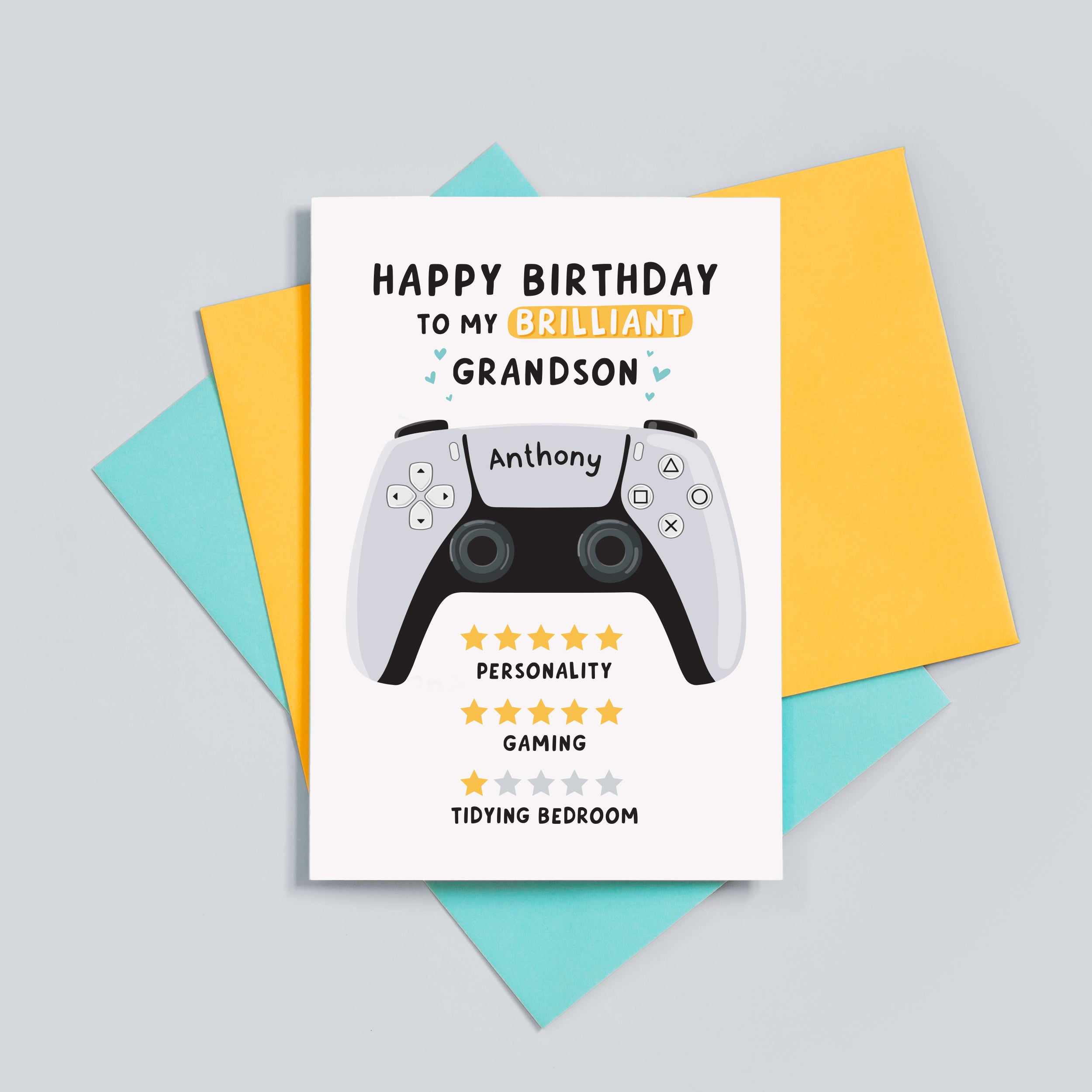 Funny gamer birthday card which reads 'happy birthday to my brilliant Grandson'. 5 stars for personality, 5 stars for gaming and 1 star for tidying bedroom. The card features an illustration of a PS5 controller and can be personalised with a name.
