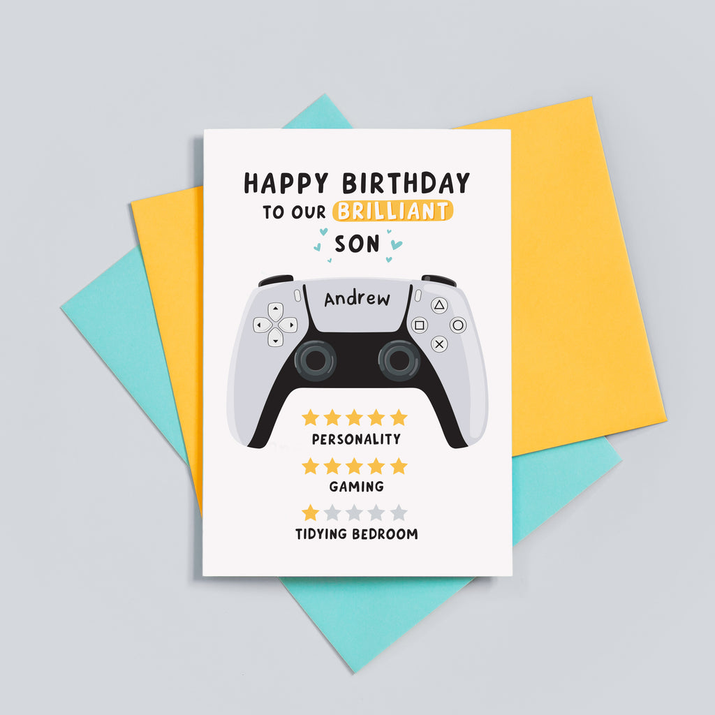 Funny gamer birthday card which reads 'happy birthday to our brilliant son'. 5 stars for personality, 5 stars for gaming and 1 star for tidying bedroom. The card features an illustration of a PS5 controller and can be personalised with a name.