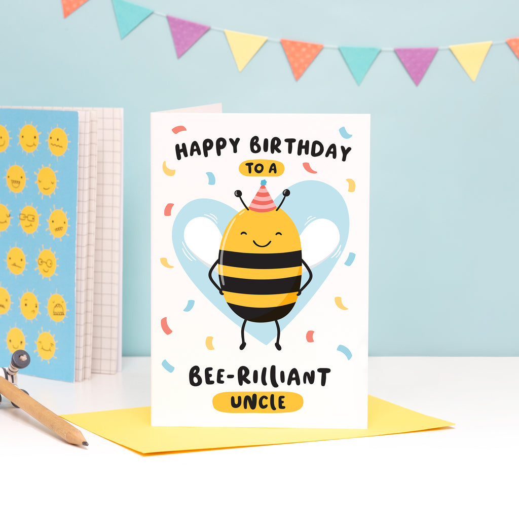 Happy birthday to a bee-rilliant Uncle. A cute and punny card featuring a happy bee wearing a party hat to represent Uncle, with a light blue heart in the background and a sprinkle of confetti.