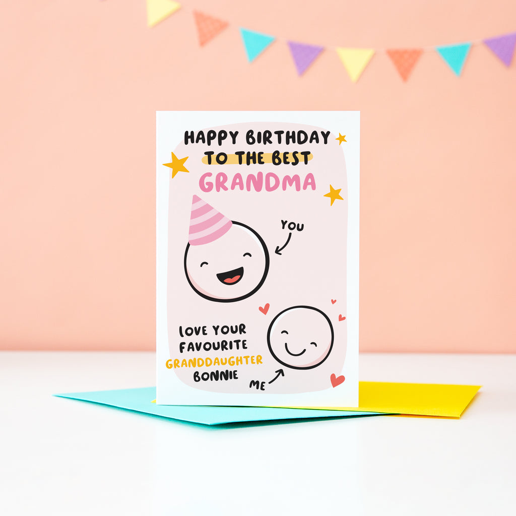 This card features two happy faces, one wearing a party hat representing Grandama and the other representing Granddaughter. The card reads 'happy birthday to the best Grandma, love your favourite Granddaughter'. There is space underneath the word Granddaughter to personalise with a name.