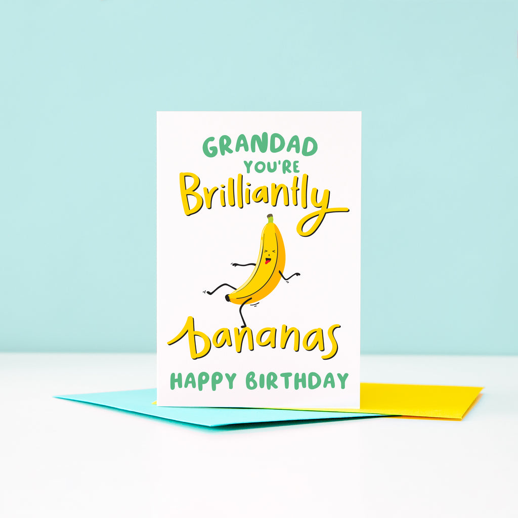 A bright and happy Birthday card featuring a dancing banana with a silly face and the words Grandad, you're brilliantly bananas.