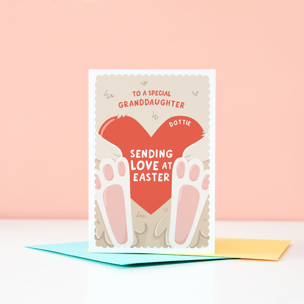 A cute Easter card featuring a fluffy bunny holding a red love heart. The card can be customised for any recipient and there is space on the love heart to include a name too.