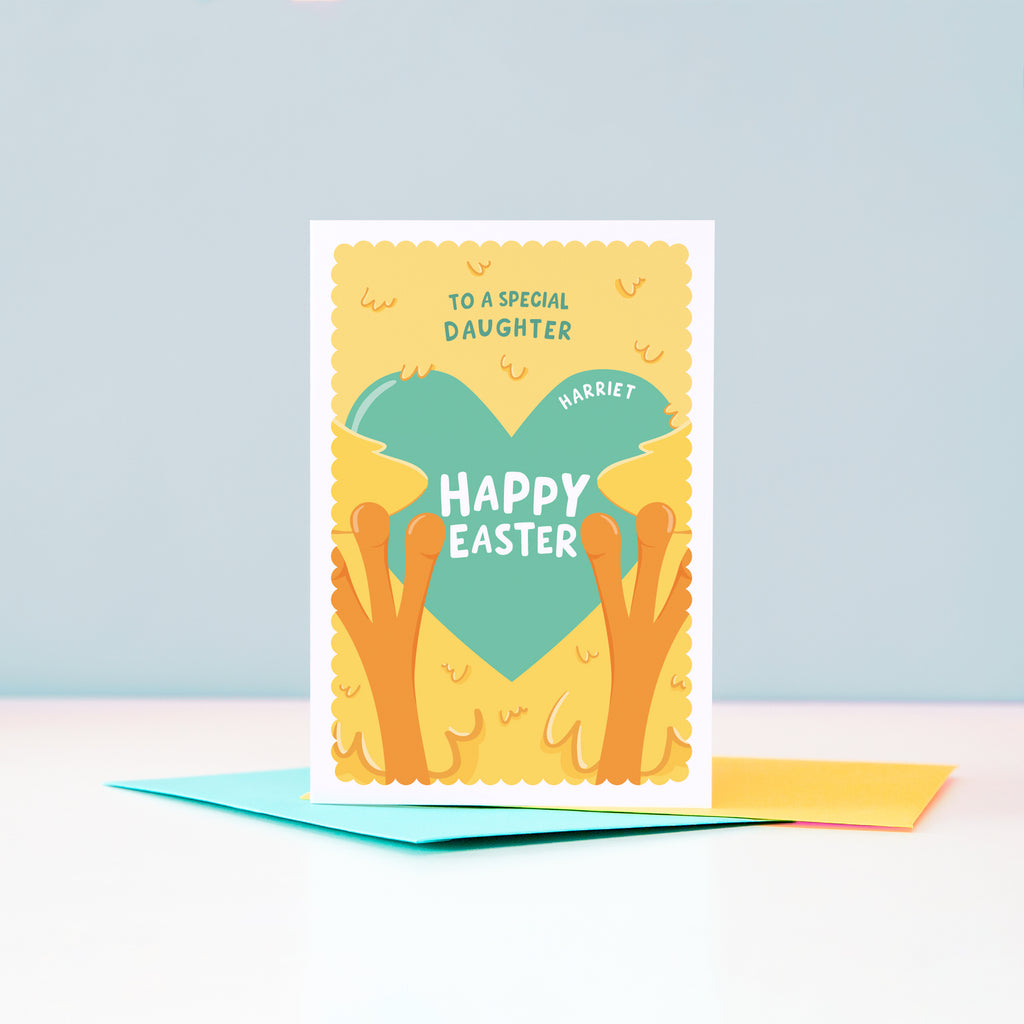 A cute and colourful Easter card featuring a fluffy yellow chick holding a sea green love heart. The card can be customised for any recipient and there is space on the love heart to include a name too.