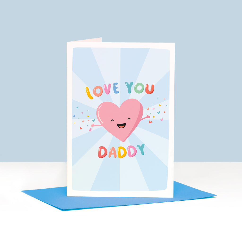 A cute and colourful card featuring a happy love heart with arms open wide throwing a sprinkle of smaller colourful love hearts. The card reads love you Daddy.