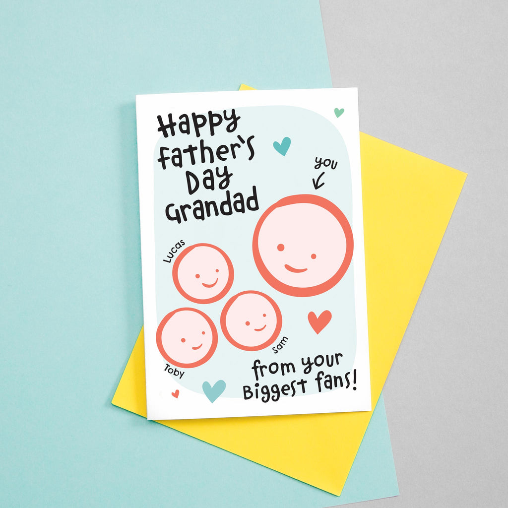 Happy Father's day Grandad - from your biggest fans! A cute greetings card for Grandad featuring the smiling faces of three children which can be customised to include their names. The card colours are Turquoise and red.