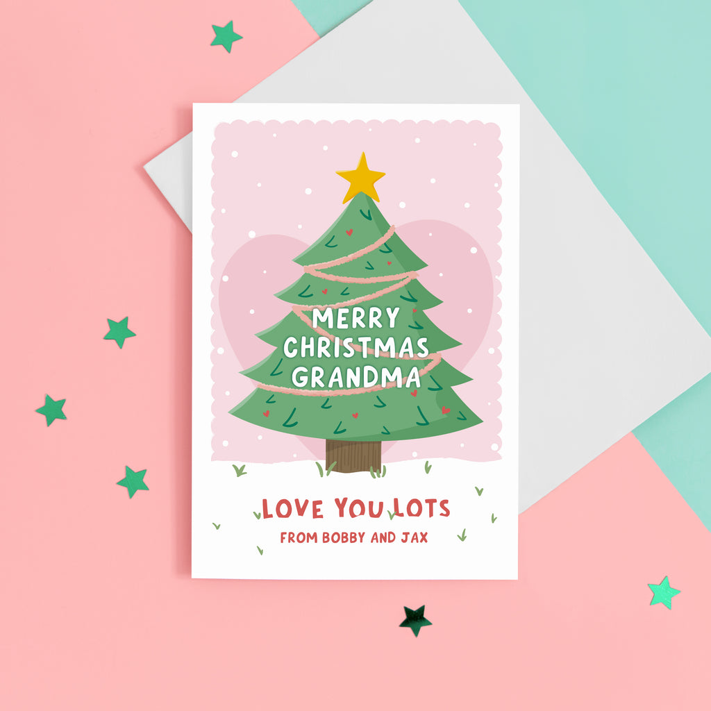 Merry Christmas Grandma. Love you lots. A beautiful Christmas card with a festive tree, star and love hearts on a snowy background in pink. The card can be name customised for Grandma and can include the grandchild’s name(s) at the bottom.