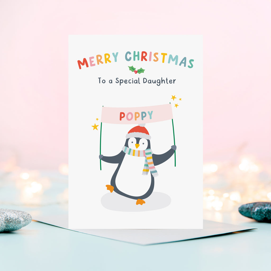 A cute and colourful Christmas card featuring a penguin holding a banner which can be personalised with a child’s name. The card reads Merry Christmas to a Special Daughter – the card can be customised for any recipient.