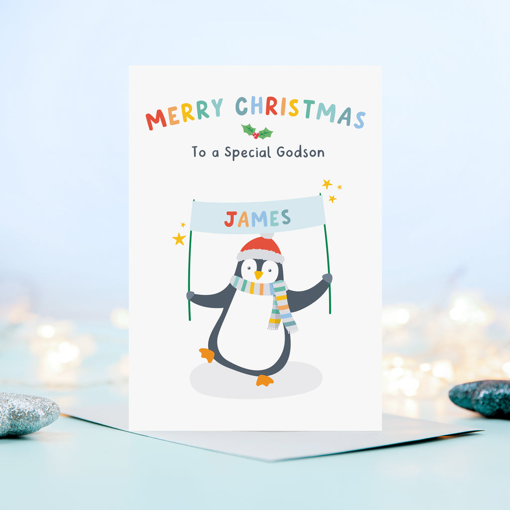 A cute and colourful Christmas card featuring a penguin holding a banner which can be personalised with a child’s name. The card reads Merry Christmas to a Special Godson – the card can be customised for any recipient.