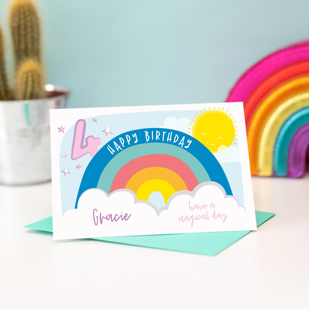 Rainbow happy birthday card with sun, clouds and stars. Personalised with and name and age. Shown with age 4.