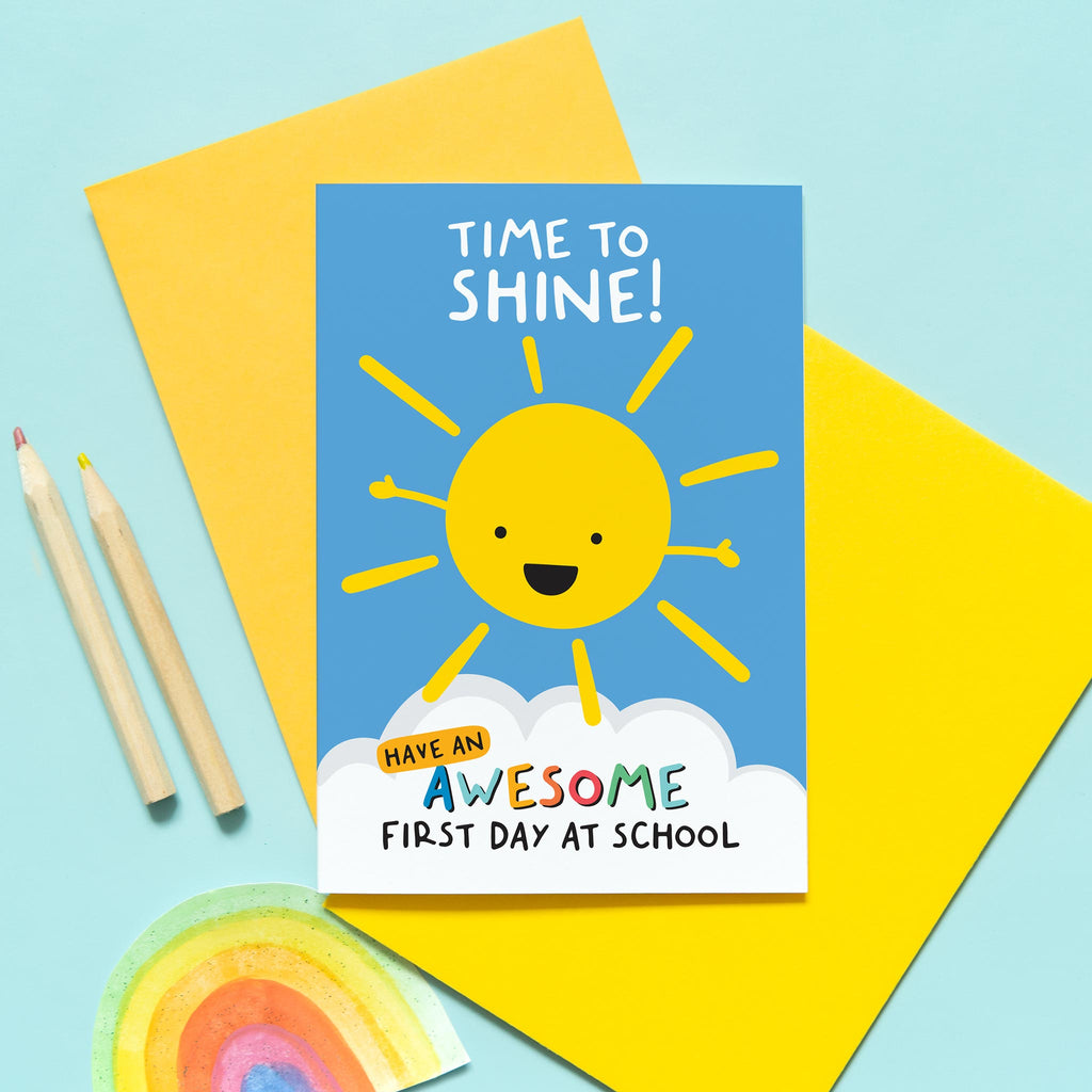 bright and happy good luck on your first day at school card. Features a smiley sunshine and colourful text. The wording reads, time to shine, have an awesome first day at school. Personalised with any child's name