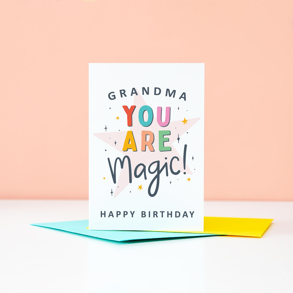 Grandma you are magic Happy Birthday. This bright and colourful typographic card features stars and bold text.