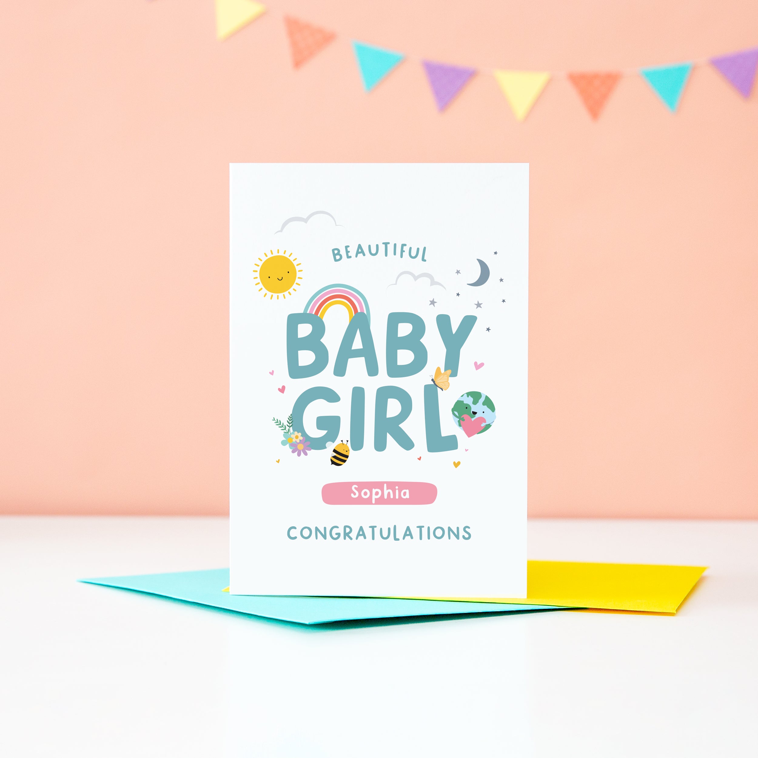 Beautiful Baby Girl Congratulations. A cute and colourful card featuring mini illustrations of a sunshine, rainbow, moon, stars, world holding a heart, balloon, tshirt and bee. This card has space to personalise with the baby's name.