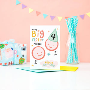 To my big sister birthday card. Colourful card features two happy faces and personalised with any name and age