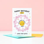 Load image into Gallery viewer, Text on this card reads ‘Happy birthday to a blooming lovely Mum, love you lots!’. A cute and punny card featuring a happy flower in full bloom to represent Mum, with a collection of hearts. The card can be personalised with Mum’s preferred name eg. Mum, Mummy, Mam etc.
