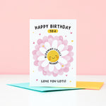 Load image into Gallery viewer, Text on this card reads ‘Happy birthday to a blooming lovely Mummy, love you lots!’. A cute and punny card featuring a happy flower in full bloom to represent Mum, with a collection of hearts. The card can be personalised with Mum’s preferred name eg. Mum, Mummy, Mam etc.
