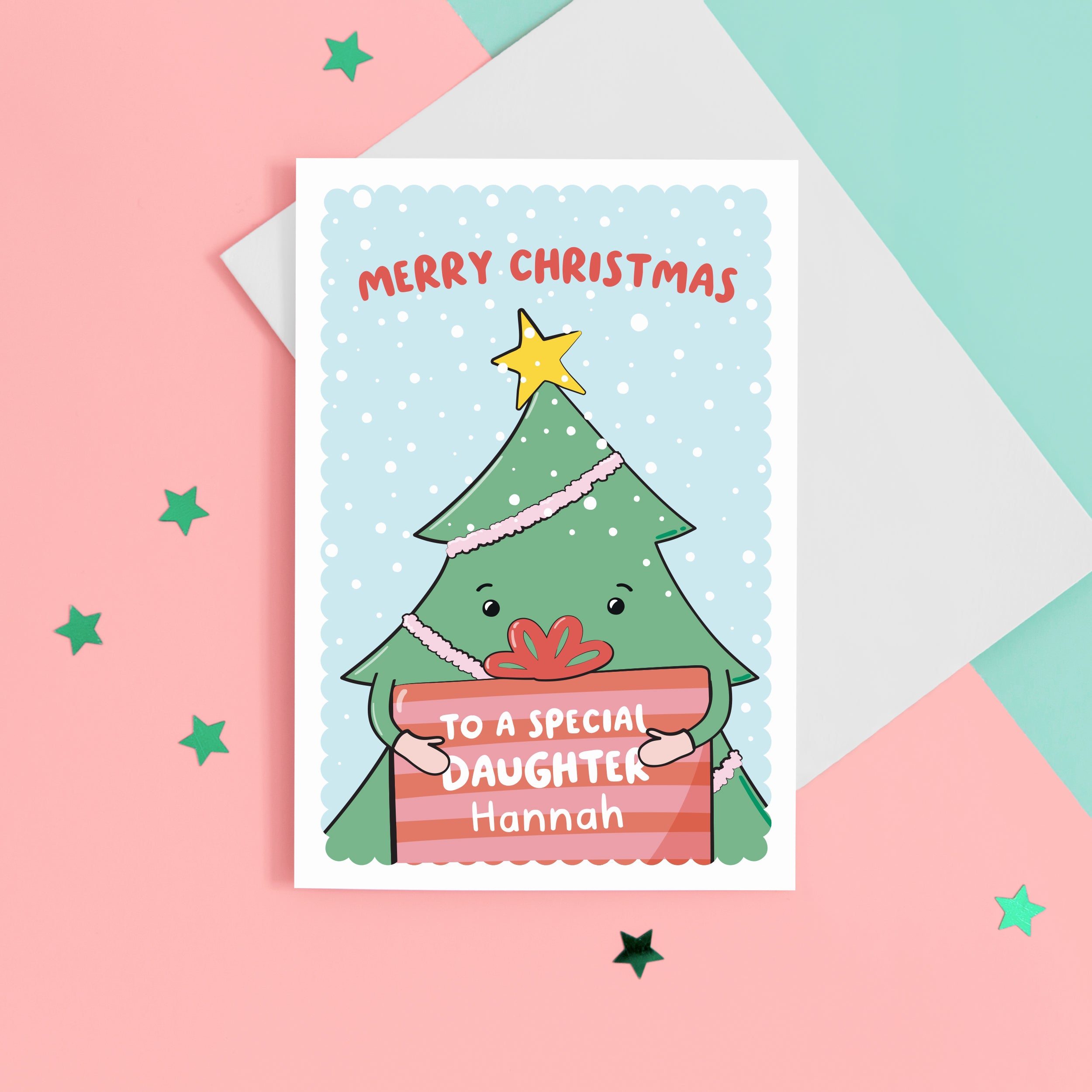 A cute Christmas card with a blue background, featuring a Christmas tree holding a present with a sprinkling of snow. The card reads Merry Christmas to a special Daughter with space to personalise with a name.