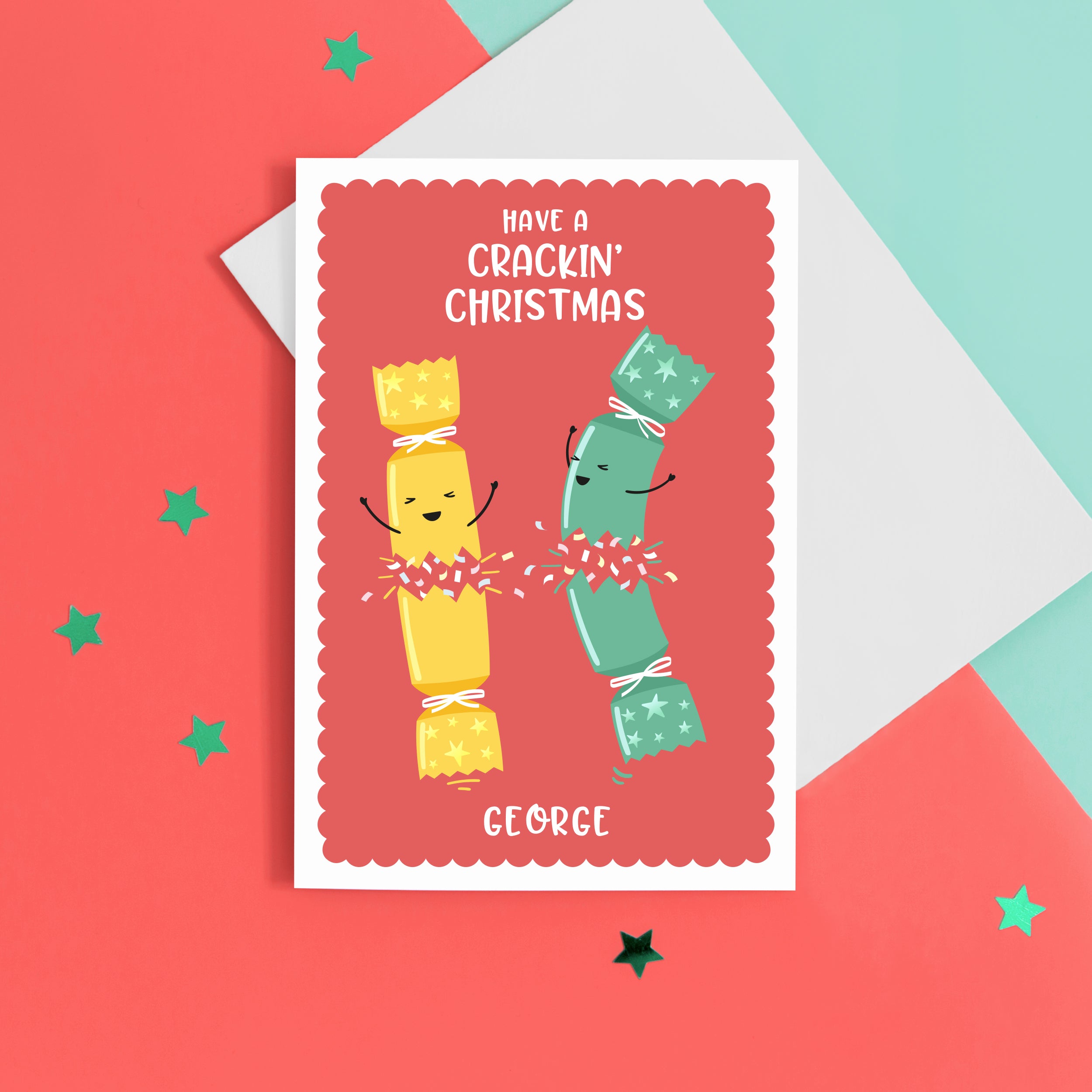 A funny Christmas card with a red background, featuring two happy Christmas crackers and the words 'have a crackin' Christmas', with space to personalise with a name at the bottom.