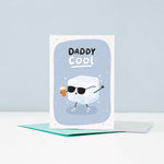 Load image into Gallery viewer, A cute card for cool Daddies. Featuring an illustration of an icecube wearing sunglasses and adidas trainers holding a beer. The card has a grey background and the words Daddy Cool.
