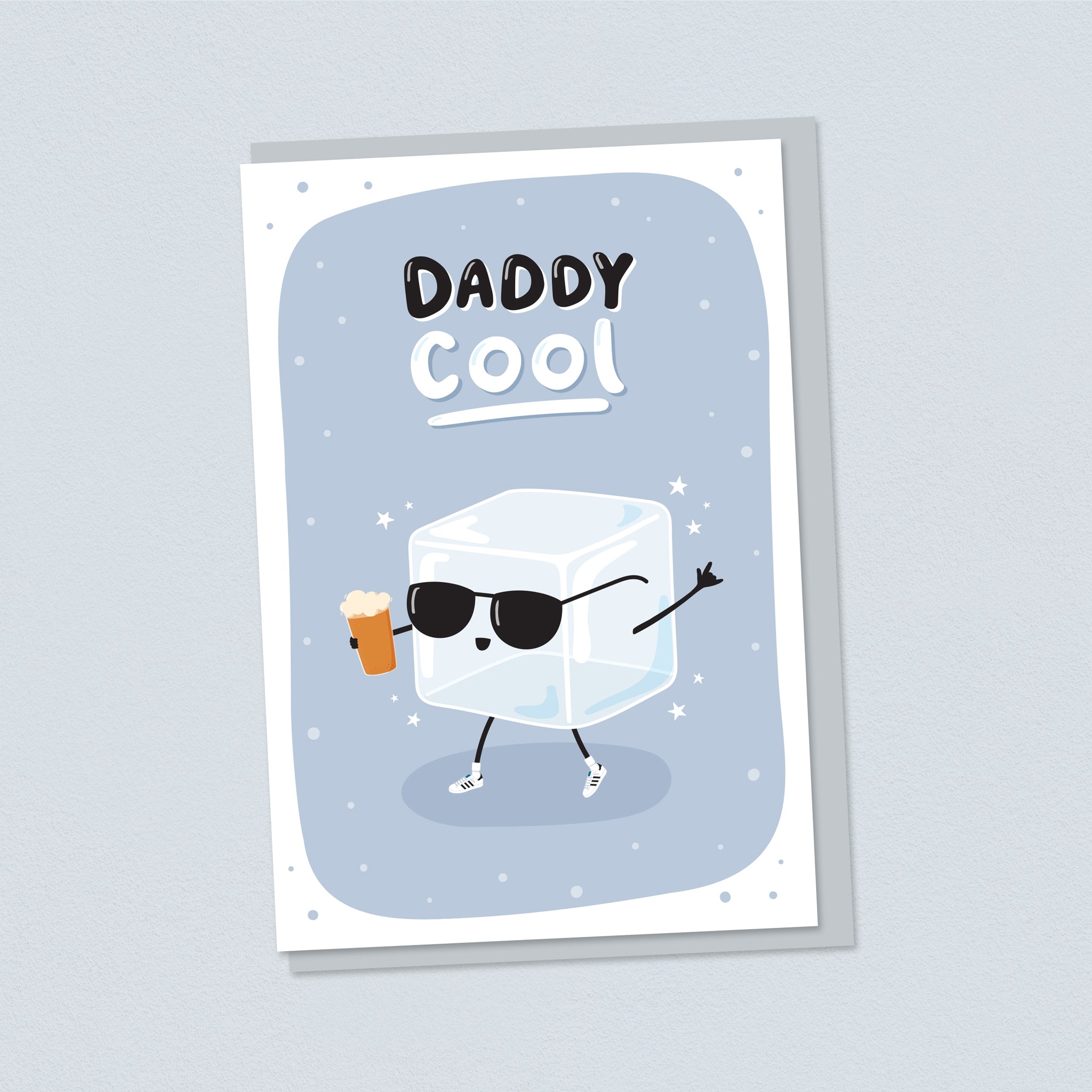 A cute card for cool Daddies. Featuring an illustration of an icecube wearing sunglasses and adidas trainers holding a beer. The card has a grey background and the words Daddy Cool.