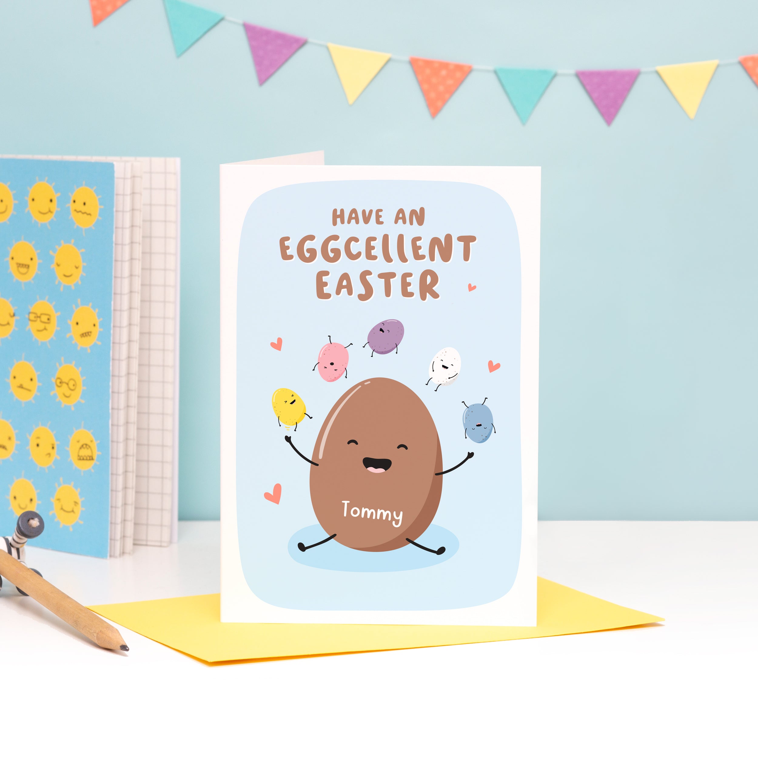 A funny Easter card which reads, 'have an excellent Easter'. The card features a happy chocolate Easter egg, juggling mini eggs and has space on the egg to personalise with a name.