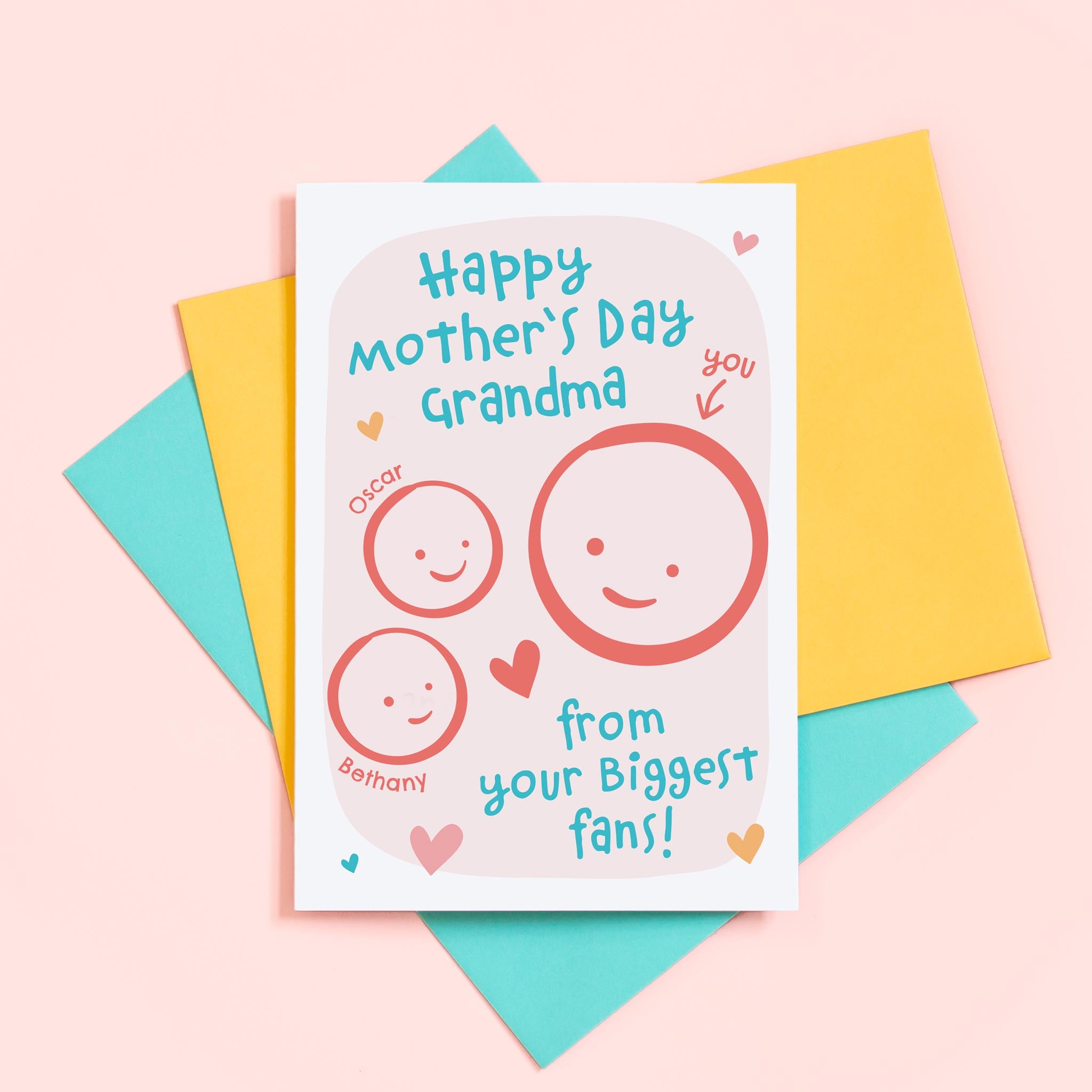 A cute Mother's day card for Grandma from her biggest fans. This card features a smiling face representing Grandma and 2 children's faces which can be personalised with names. The background of the card is light pink and includes a collection of hearts around the design.