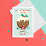 Load image into Gallery viewer, A super cute card featuring a happy little Christmas pudding illustration, holding a present. The card reads &#39;Happy 1st Christmas as my Daddy from your little pudding&#39;, with space to personalise with the baby&#39;s name.
