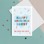 Load image into Gallery viewer, A sweet Christmas card with a light blue background and small hand drawn illustrations of Christmas trees, presents, stars and hearts. The card has snow topped wording in festive colours which reads &#39;Happy Christmas Daddy&#39;. The bottom of the card can be customised with your own message.
