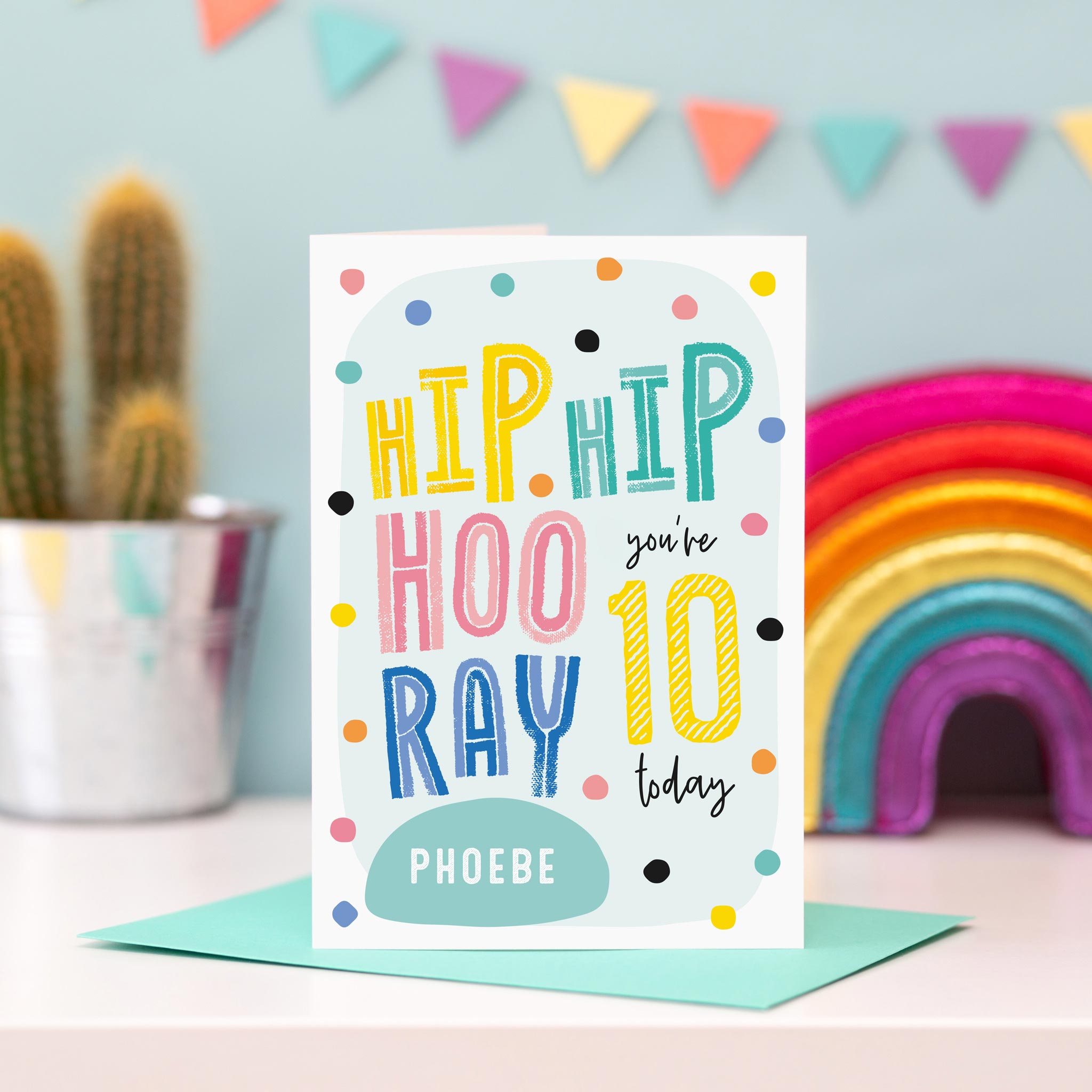 Colourful, dotty birthday card with rhyme and hip hip hooray. personalised for any name and age. Shown with age 10..