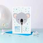 Load image into Gallery viewer, Koala balloon birthday card. A cute card featuring a baby Koala face on a balloon and personalised with any name and age
