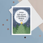 Load image into Gallery viewer, This beautiful Christmas card features festive trees with a star in front of a glowing distant moon which has the personalised message on. This card reads ‘sending lots of love and Christmas wishes Gran&#39;, the name for Grandma can be personalised.
