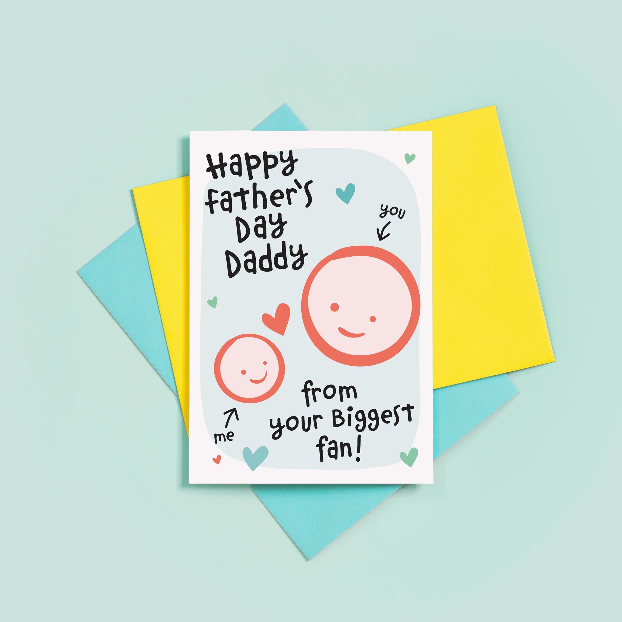 Happy first Father's day - from your biggest fan. This sweet Father's day card features smiling father and childs faces with hearts against a turquoise background. The child's name can be added.