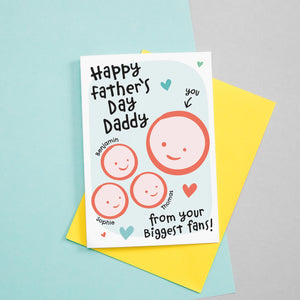 Happy first Father's day - from your biggest fans. This sweet Father's day card features smiling father and three childrens faces with hearts against a turquoise background. Each child's name can be added.