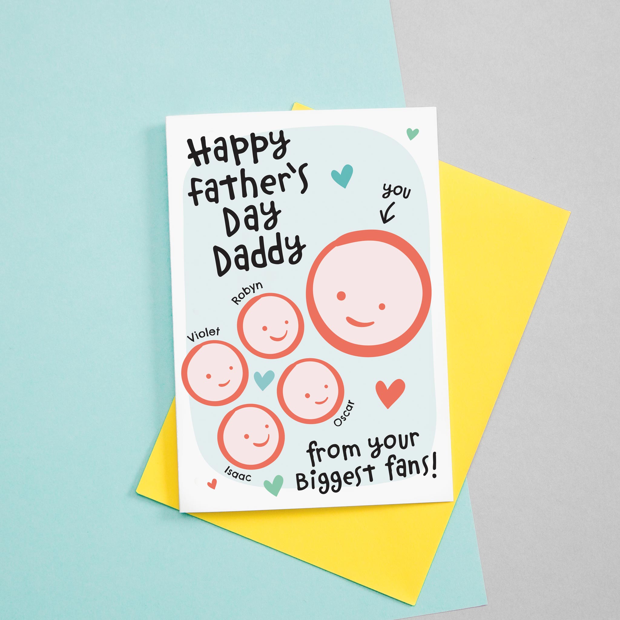 Happy first Father's day - from your biggest fans. This sweet Father's day card features smiling father and four childrens faces with hearts against a turquoise background. Each child's name can be added.