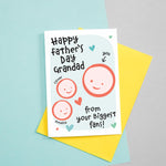 Load image into Gallery viewer, Happy Father&#39;s day Grandad - from your biggest fans! A cute greetings card for Grandad featuring the smiling faces of two children which can be customised to include their names. The card colours are Turquoise and red.
