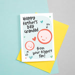 Load image into Gallery viewer, Happy Father&#39;s day Grandad - from your biggest fan! A cute greetings card for Grandad featuring the smiling face of a child which can be customised to include their name. The card colours are Turquoise and red.
