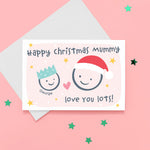 Load image into Gallery viewer, Happy Christmas Mummy, love you lots. Cute Christmas card featuring 2 faces representing Mother and child. The smaller face wears a Christmas party hat and a larger face a santa hat. The card is personalised with the child&#39;s name and has a soft pink background.
