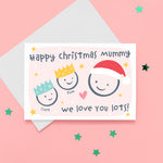 Load image into Gallery viewer, Happy Christmas Mummy, we love you lots. Cute Christmas card featuring 3 faces representing Mummy and 2 children. The smaller faces wear Christmas party hats and the larger face a santa hat. The card is personalised with the children&#39;s names and has a soft pink background.
