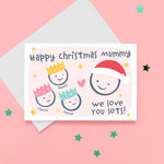 Load image into Gallery viewer, Happy Christmas Mummy, we love you lots. Cute Christmas card featuring 4 faces representing Mummy and 3 children. The smaller faces wear Christmas party hats and the larger face a santa hat. The card is personalised with the children&#39;s names and has a soft pink background.
