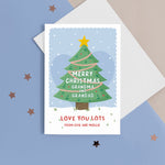 Load image into Gallery viewer, Merry Christmas Grandma &amp; Grandad. Love you lots. A beautiful Christmas card with a festive tree, star and love hearts on a snowy background in blue. The card can be name customised for the grandparents and can include who the card is from at the bottom.
