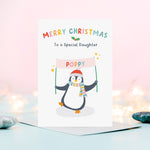 Load image into Gallery viewer, A cute and colourful Christmas card featuring a penguin holding a banner which can be personalised with a child’s name. The card reads Merry Christmas to a Special Daughter – the card can be customised for any recipient.
