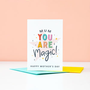 Mum you are magic. Happy Mother's day. This bright a colourful typographic card features stars and bold text.