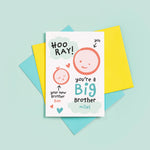 Load image into Gallery viewer, Hooray, you&#39;re a new big brother. Personalised card to congratulate someone on becoming a new big brother to a baby brother. The card features two smiling faces to represent brother and sister.
