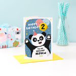 Load image into Gallery viewer, A fun and colourful card featuring a happy panda wearing a party hat, a collection of smiling balloons and a pop of confetti. The card reads happy birthday to my brilliant nephew with space to personalise with a name. There is also space on a balloon to add the childs age.
