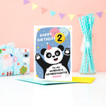 Load image into Gallery viewer, A fun and colourful card featuring a happy panda wearing a party hat, a collection of smiling balloons and a pop of confetti. The card reads happy birthday to my wonderful granddaughter with space to personalise with a name. There is also space on a balloon to add the childs age.
