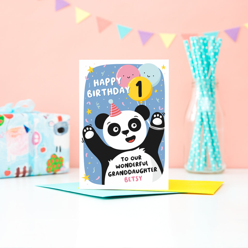 A fun and colourful card featuring a happy panda wearing a party hat, a collection of smiling balloons and a pop of confetti. The card reads happy birthday to our wonderful granddaughter with space to personalise with a name. There is also space on a balloon to add the childs age.