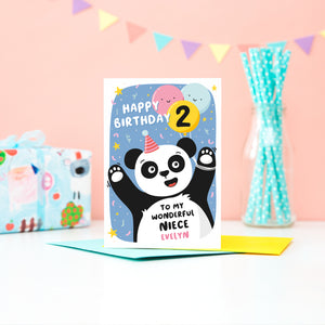 A fun and colourful card featuring a happy panda wearing a party hat, a collection of smiling balloons and a pop of confetti. The card reads happy birthday to my wonderful niece with space to personalise with a name. There is also space on a balloon to add the childs age.