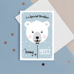 Load image into Gallery viewer, Happy Christmas to a special Brother. A cute personalised Christmas card featuring a smiling polar bear balloon in snow and stars. Add any name and personal greeting to this card.
