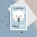 Load image into Gallery viewer, Happy Christmas to a special Son. A cute personalised Christmas card featuring a smiling polar bear balloon in snow and stars. Add any name and personal greeting to this card.
