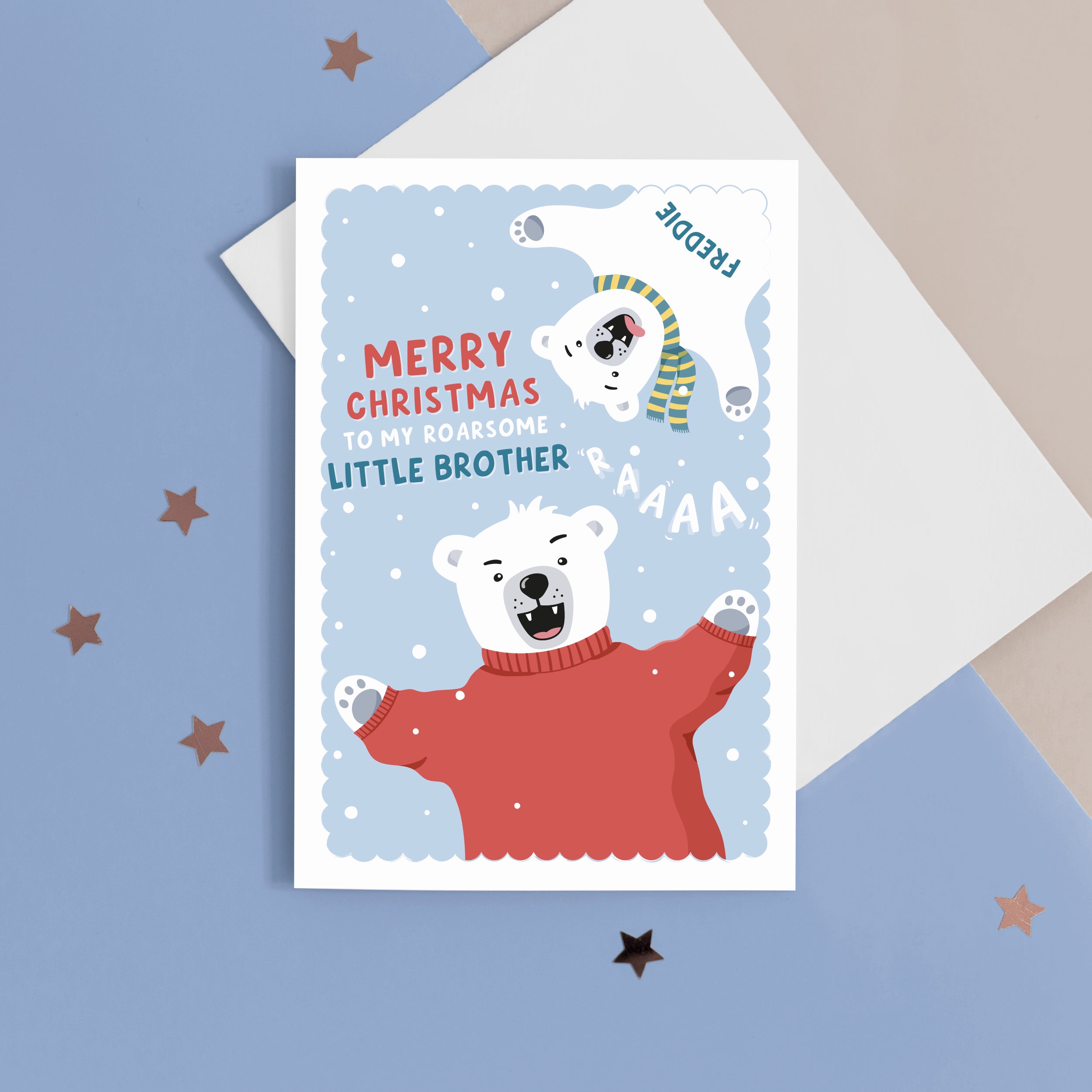 A fun Christmas card featuring two polar bears on a blue snowy background. The card reads ‘Merry Christmas to my roarsome little Brother’. The polar bears can be personalised with names to represent siblings. 